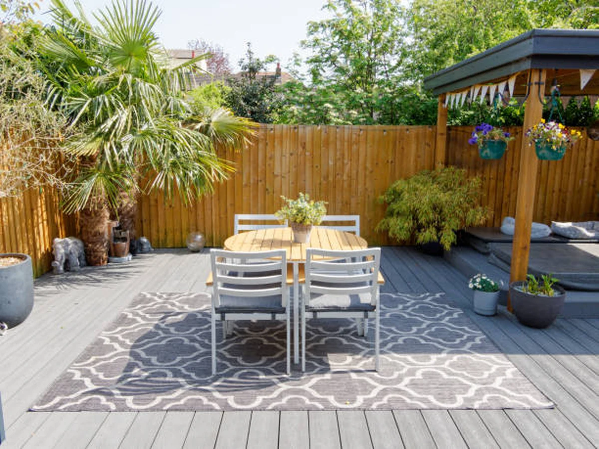 Garden deck with dining area painted and stained by Bridgend Decorators