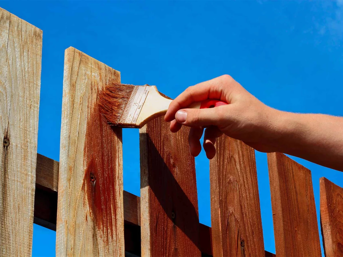 Fence painting hand staining wooden fence Bridgend